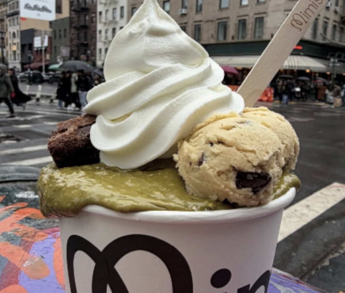 Mimi’s frozen yogurt bowl in front of a street